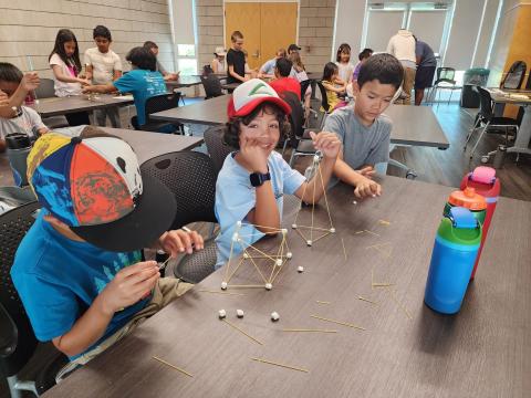 Kids working on a STEM building project