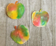 3 multicolored paper apples