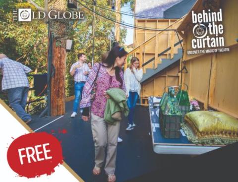 Two women and two men exploring the back of a theatrical set.