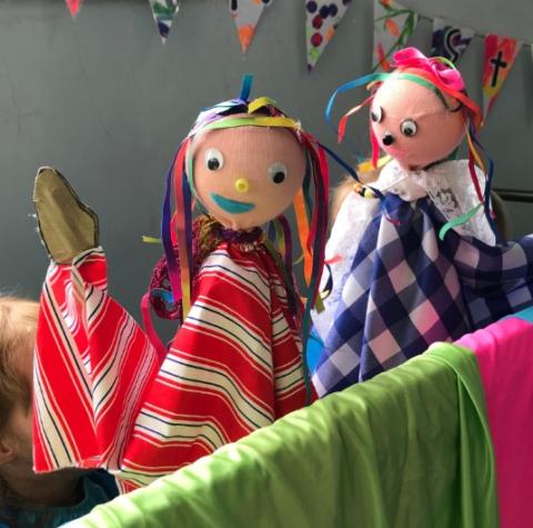 hand puppets gather near the stage