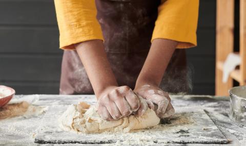 Image of hands kneading dough.