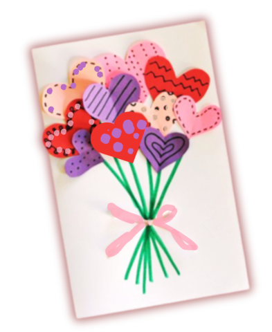 card adorned with paper heart cutouts in pink, red, and purple