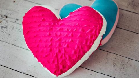 Photo of two hand sewn heart pillows