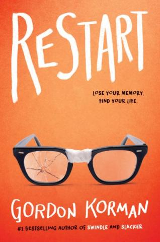 A pair of glasses on an orange background. 