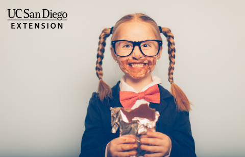 smiling child with face covered in chocolate