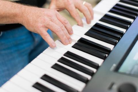 Hands playing piano