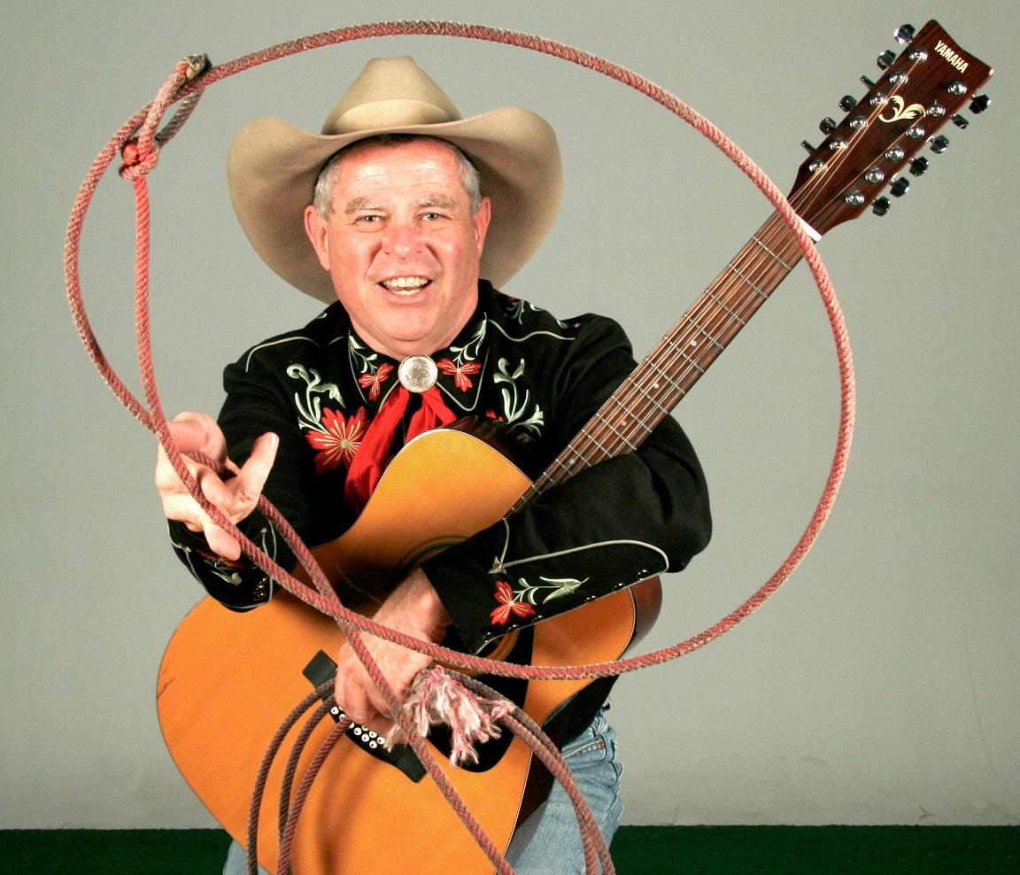 Cowboy Ken in a cowboy outfit holding a lasso