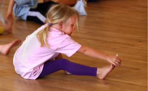 Little girl stretching