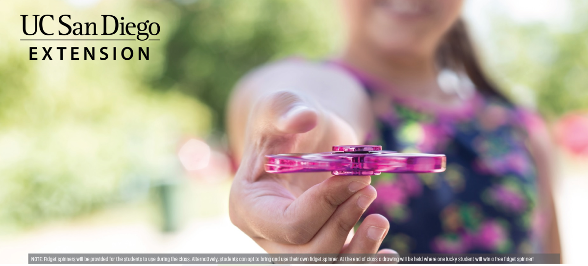 girl holding a fidget spinner