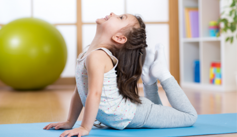 child in yoga pose