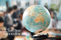 GLOBE SITTING ON A DESK IN A CLASSROOM