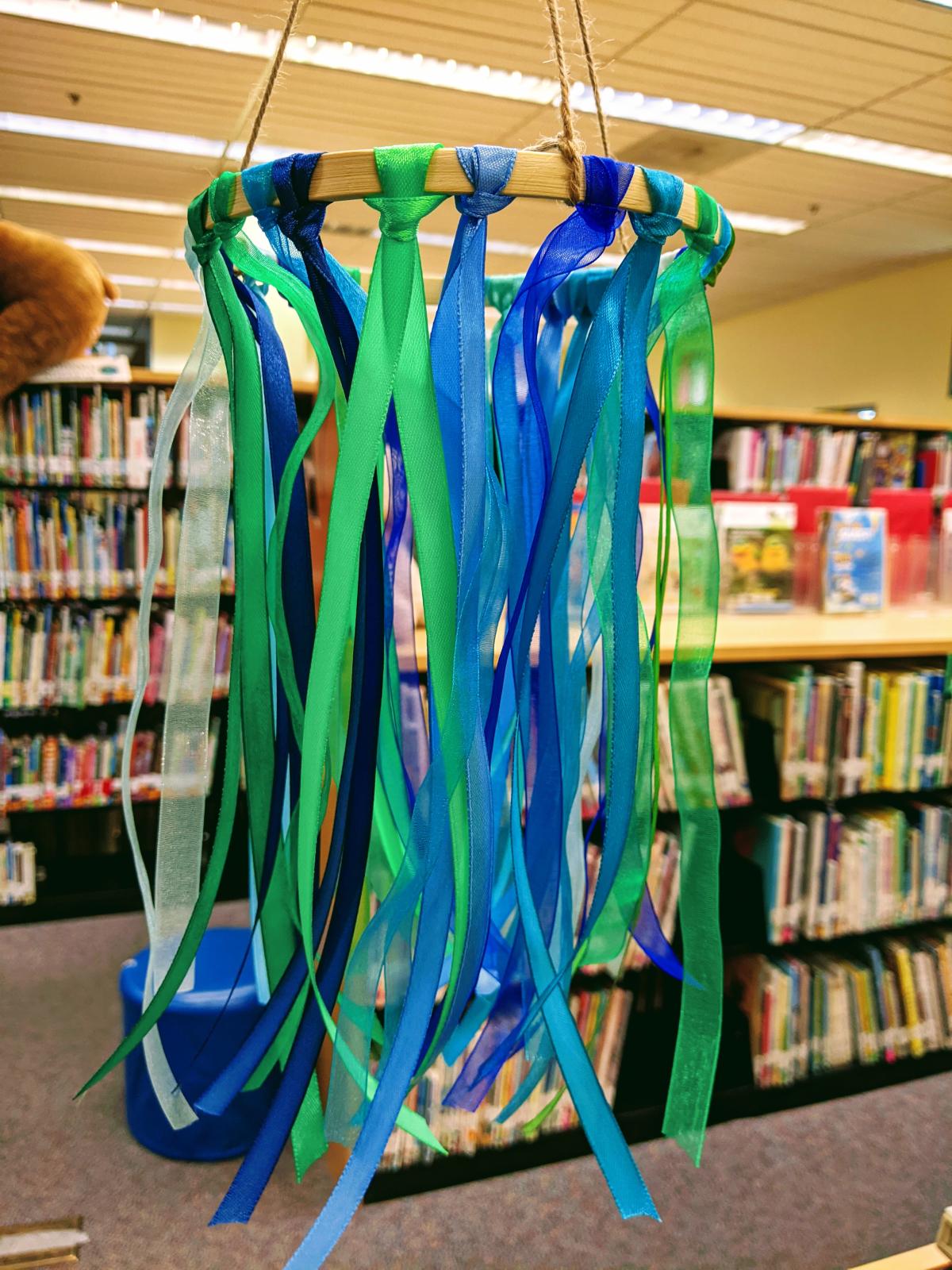 Mobile made of ribbon in various shades of blue and green