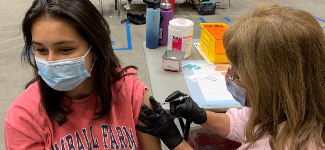 woman receiving a vaccination