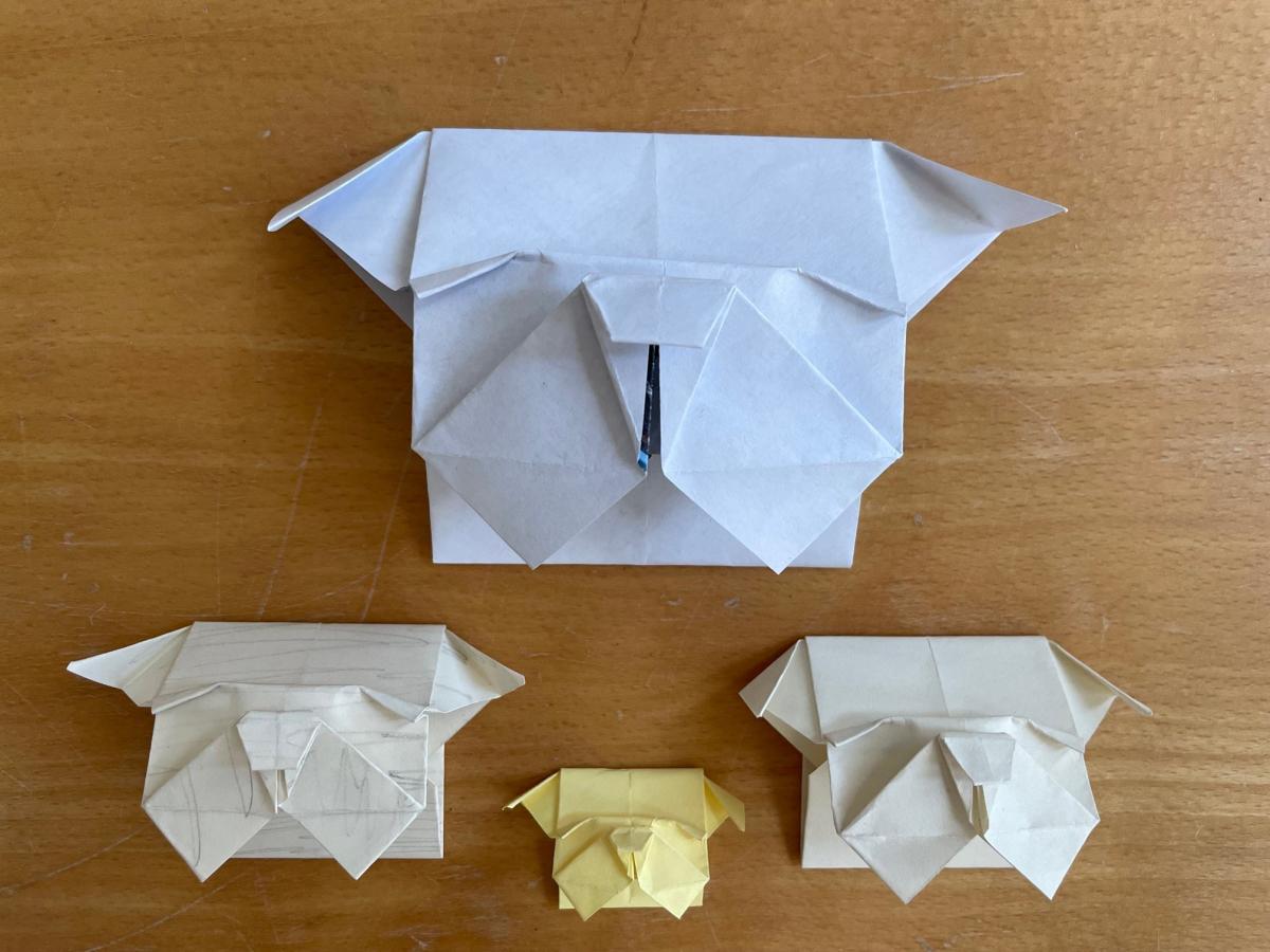 Four bookmarks made of papers, each folded into an English Bulldog's face