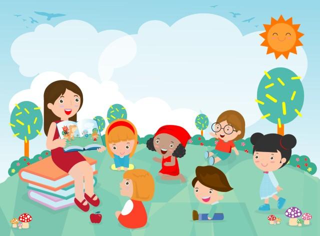 Illustration of a light skinned person with dark hair reading a book to several children with various skin tones. They are seated outside in the grass.