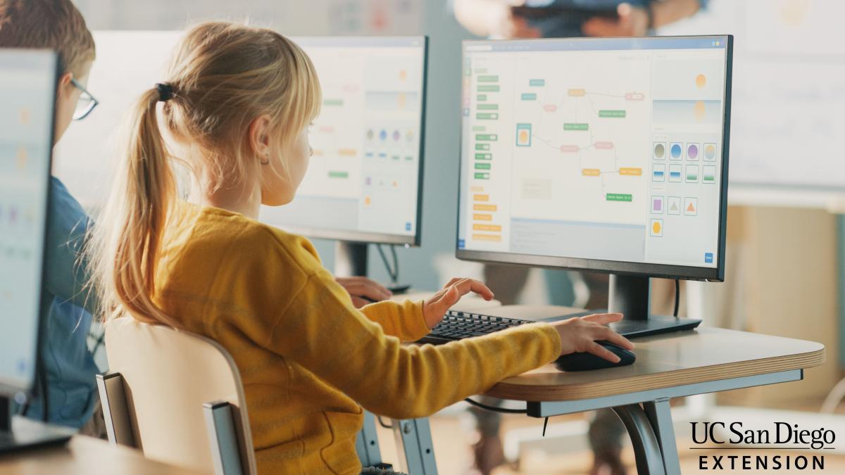 girl programming on computer