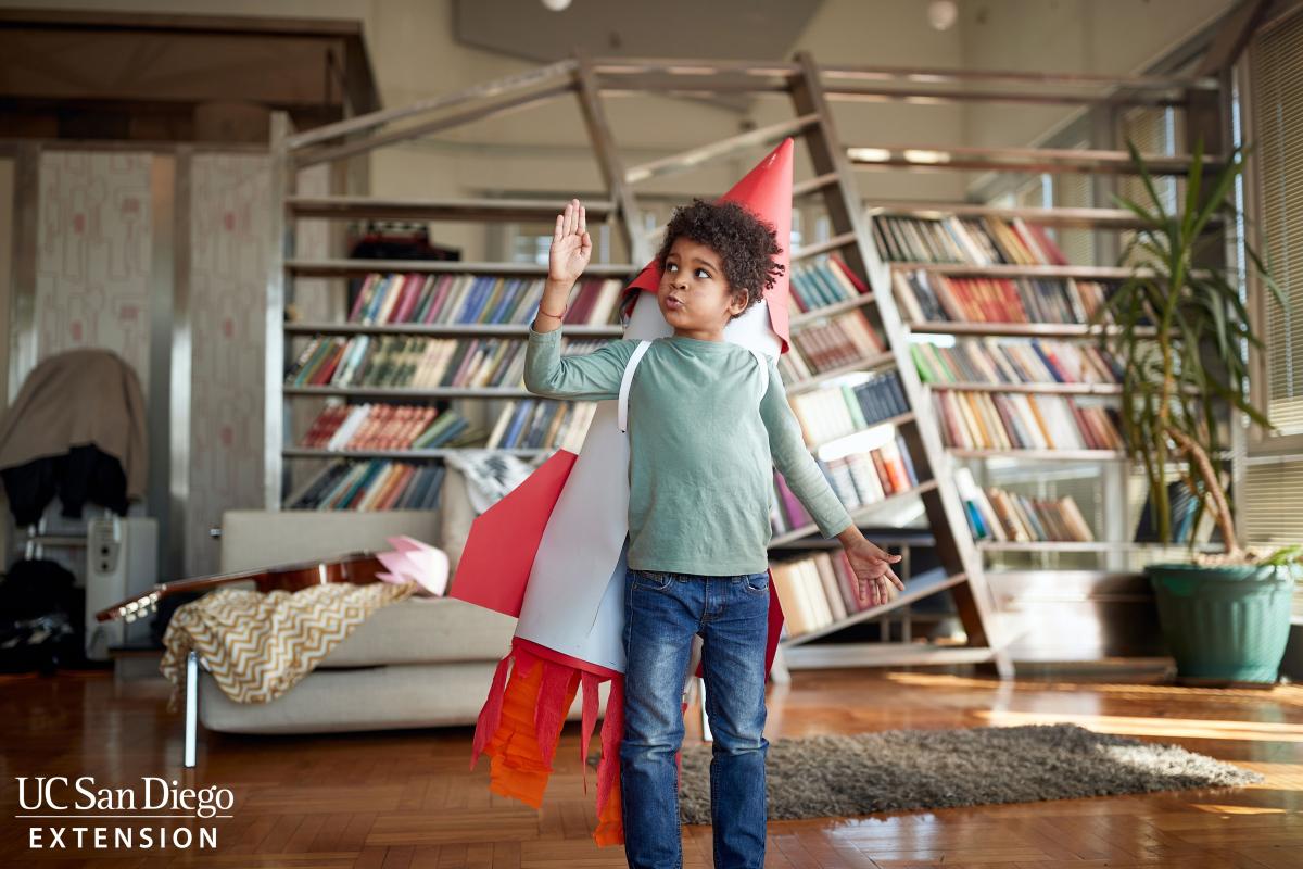 Student with giant paper rocket.