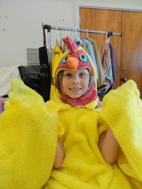 girl smiling in hen costume