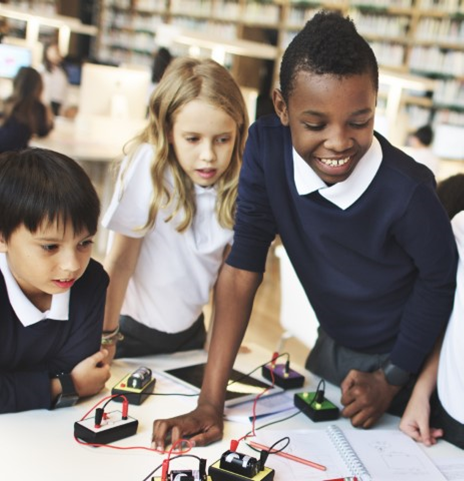 Kids with robotics and coding.