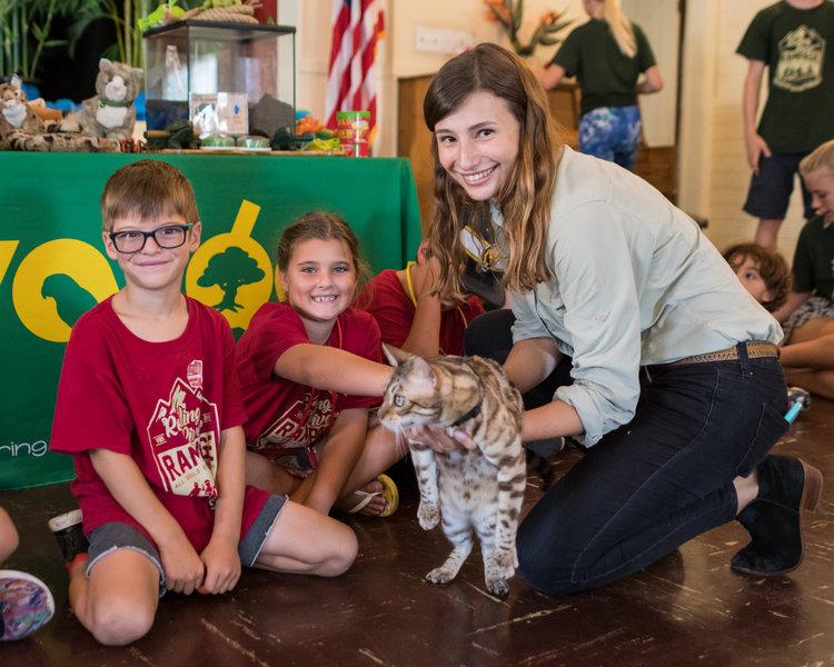 woman and children holding cat