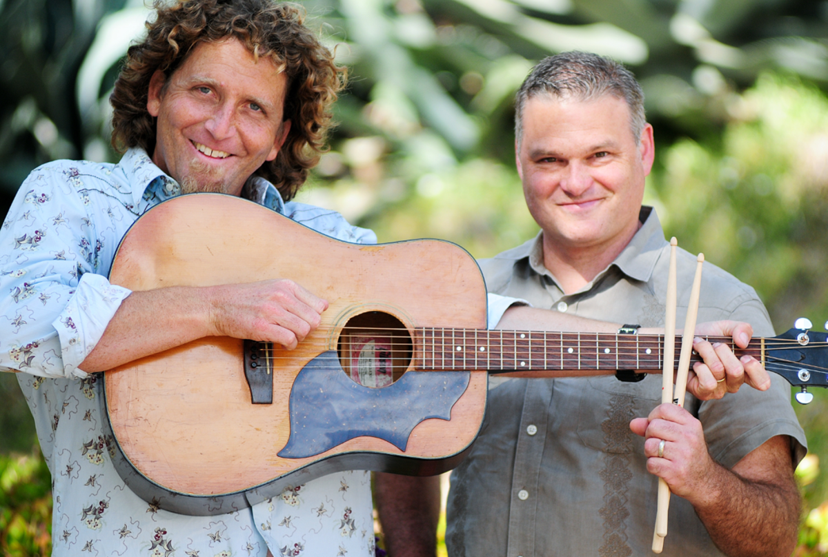 Picture of Hullabaloo performers with guitar and drum sticks.