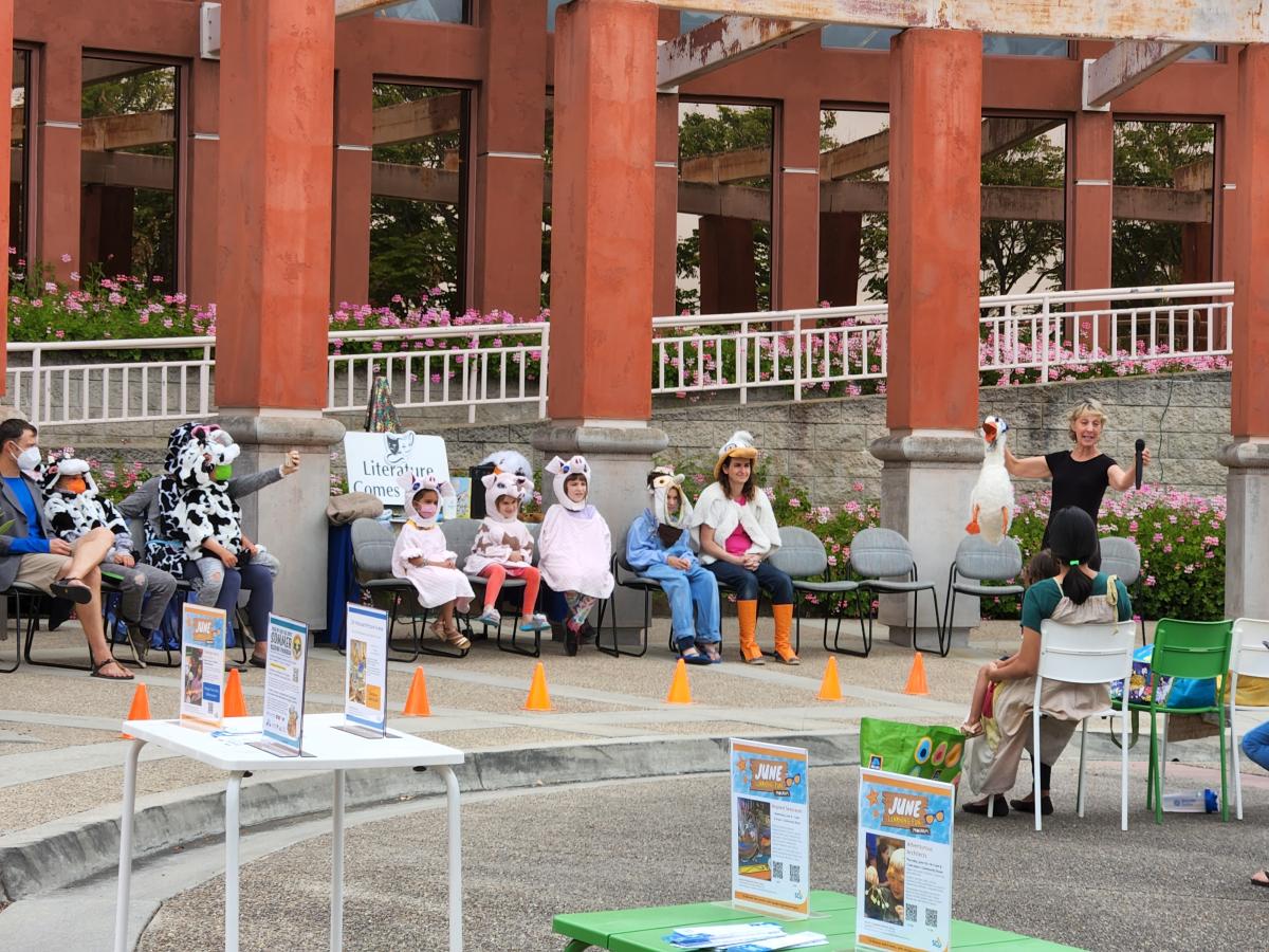 Photo of kids dressed as characters from a child's story with Stacey of Literature Comes to Life 