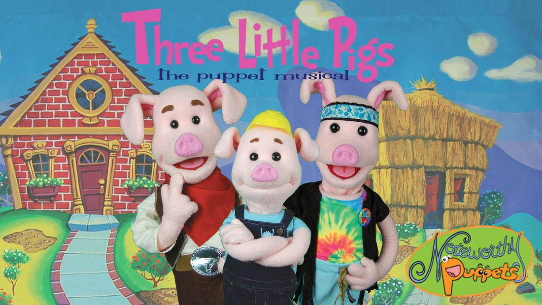 Puppets of three happy pigs in clothes with buildings in the background