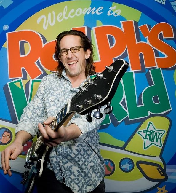 Musician with guitar with blue and yellow background