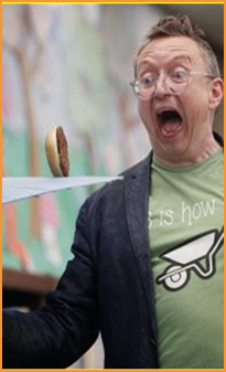 Adult male spinning hamburger on umbrella