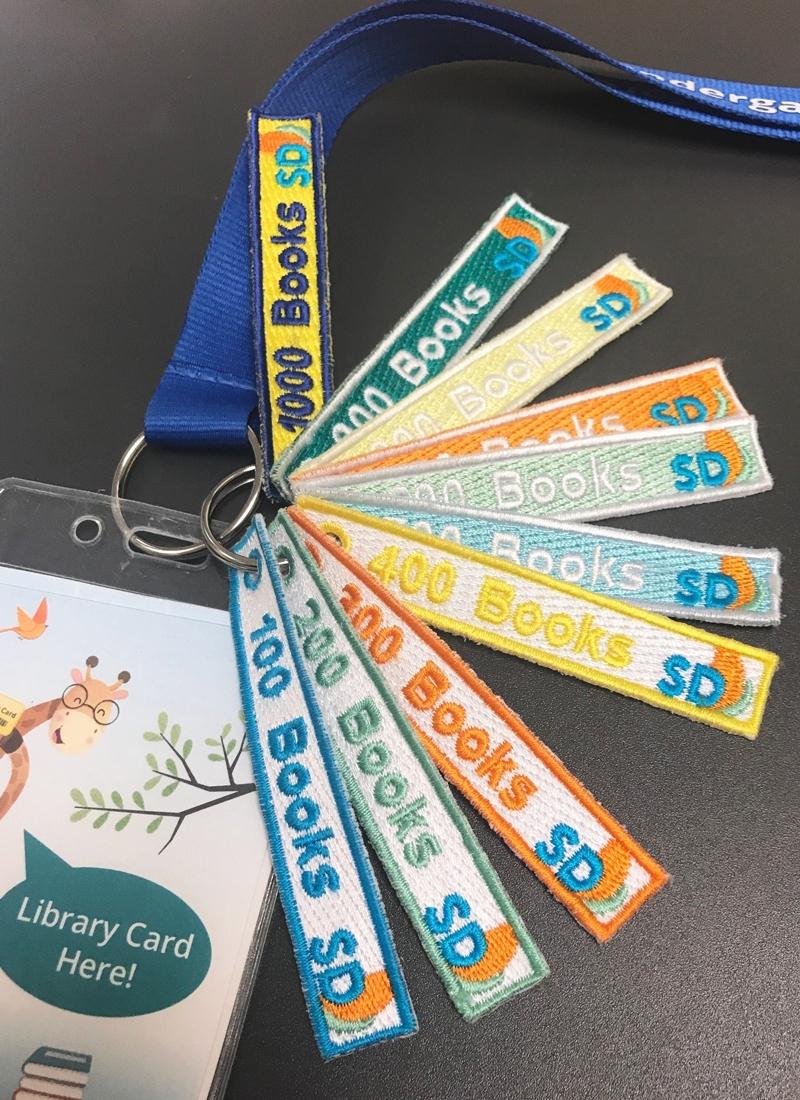 1,000 Books Before Kindergarten lanyard and milestone stripes