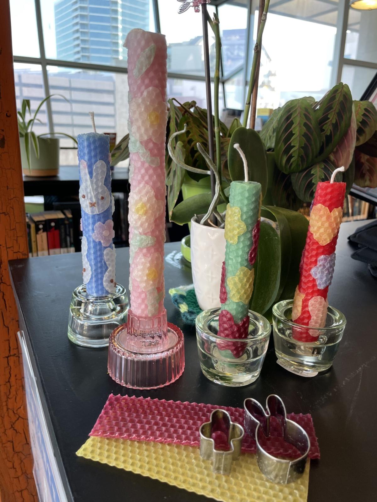 Samples of the beeswax candles in a variety of colors with different designs