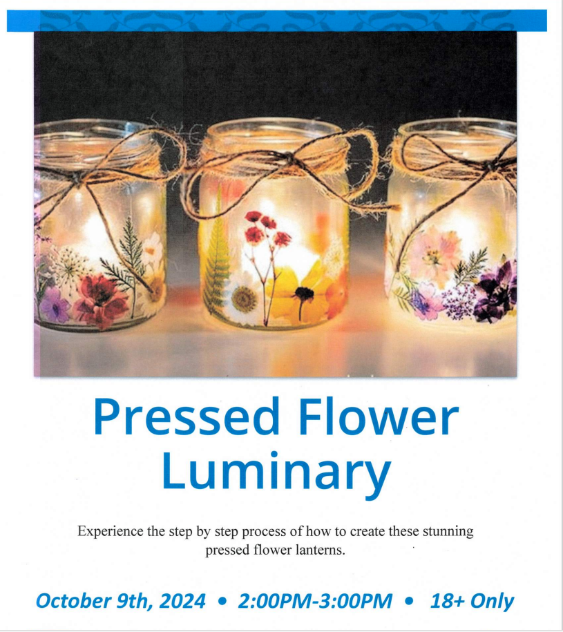 Pressed flower luminaries displayed on a table