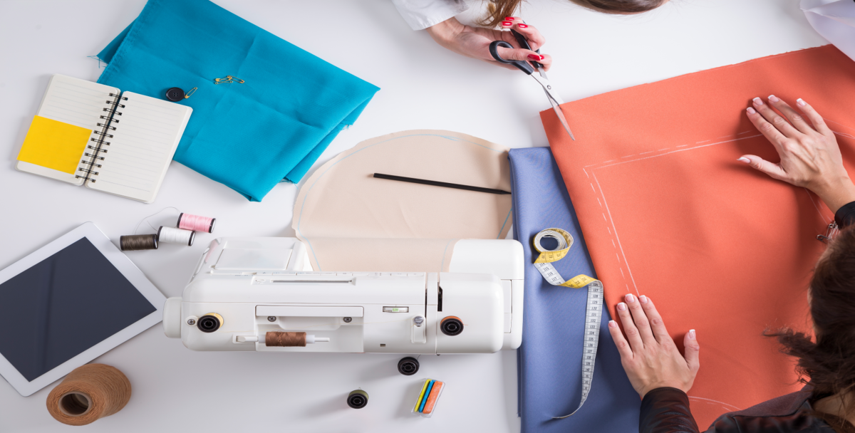 A sewing machine and colorful fabrics.