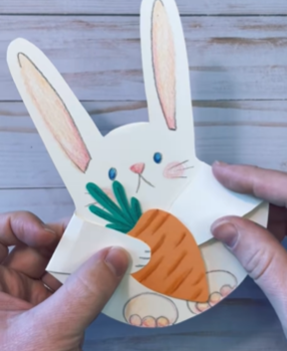 Paper bunny holding a paper carrot