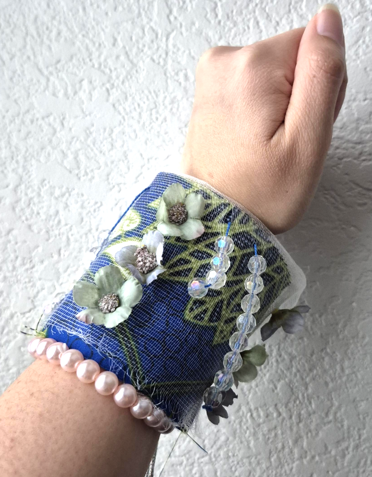 Blue bracelet covered with beads