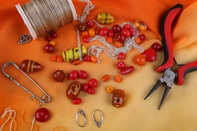 Jewelry pieces, wire, and tweezers
