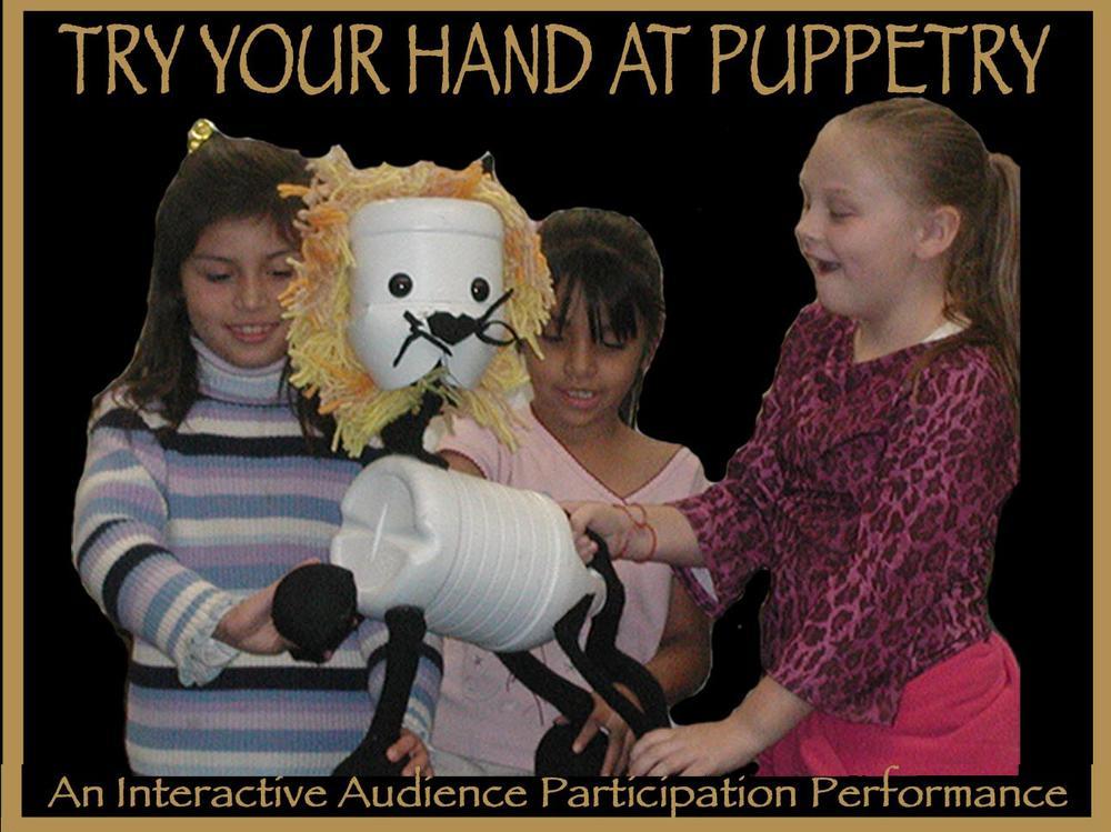 Children working with a lion puppet