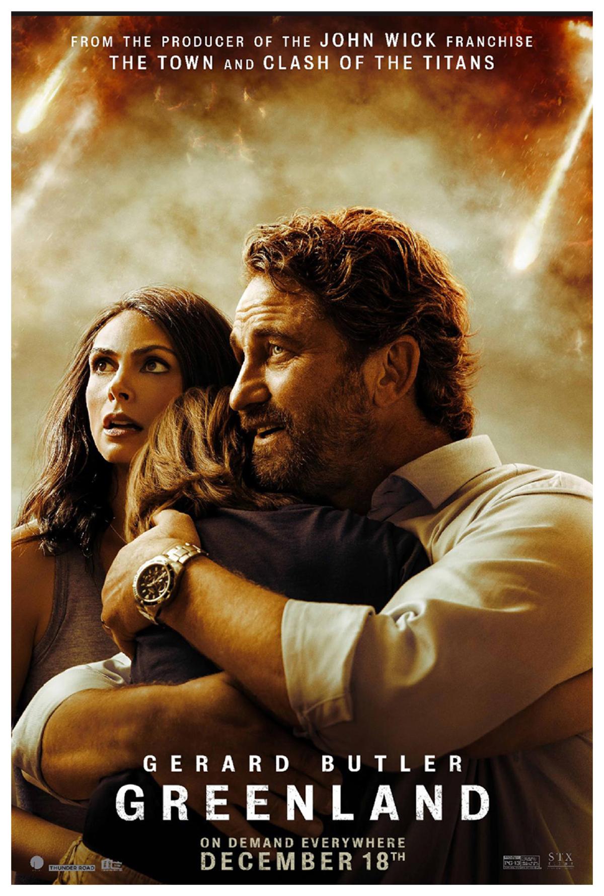 Photograph of a woman with a man, holding a child.