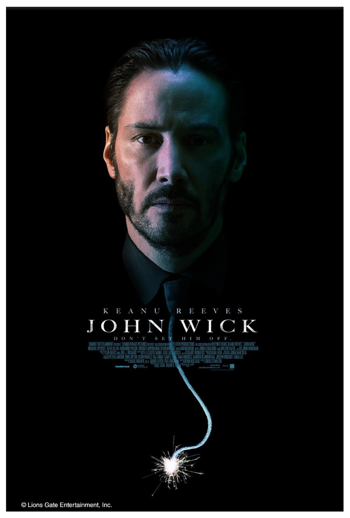 Photograph of a man's face in surrounded by darkness.