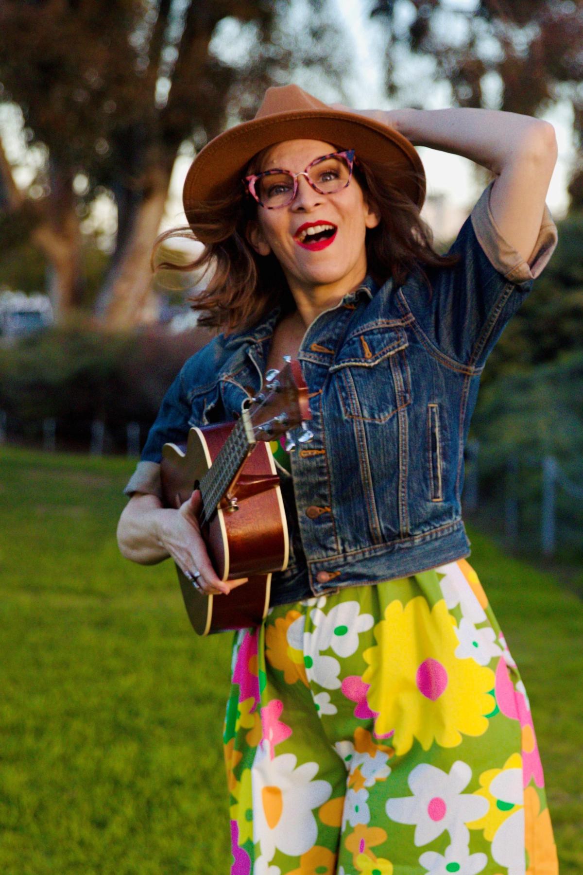 Smiling woman with guitar