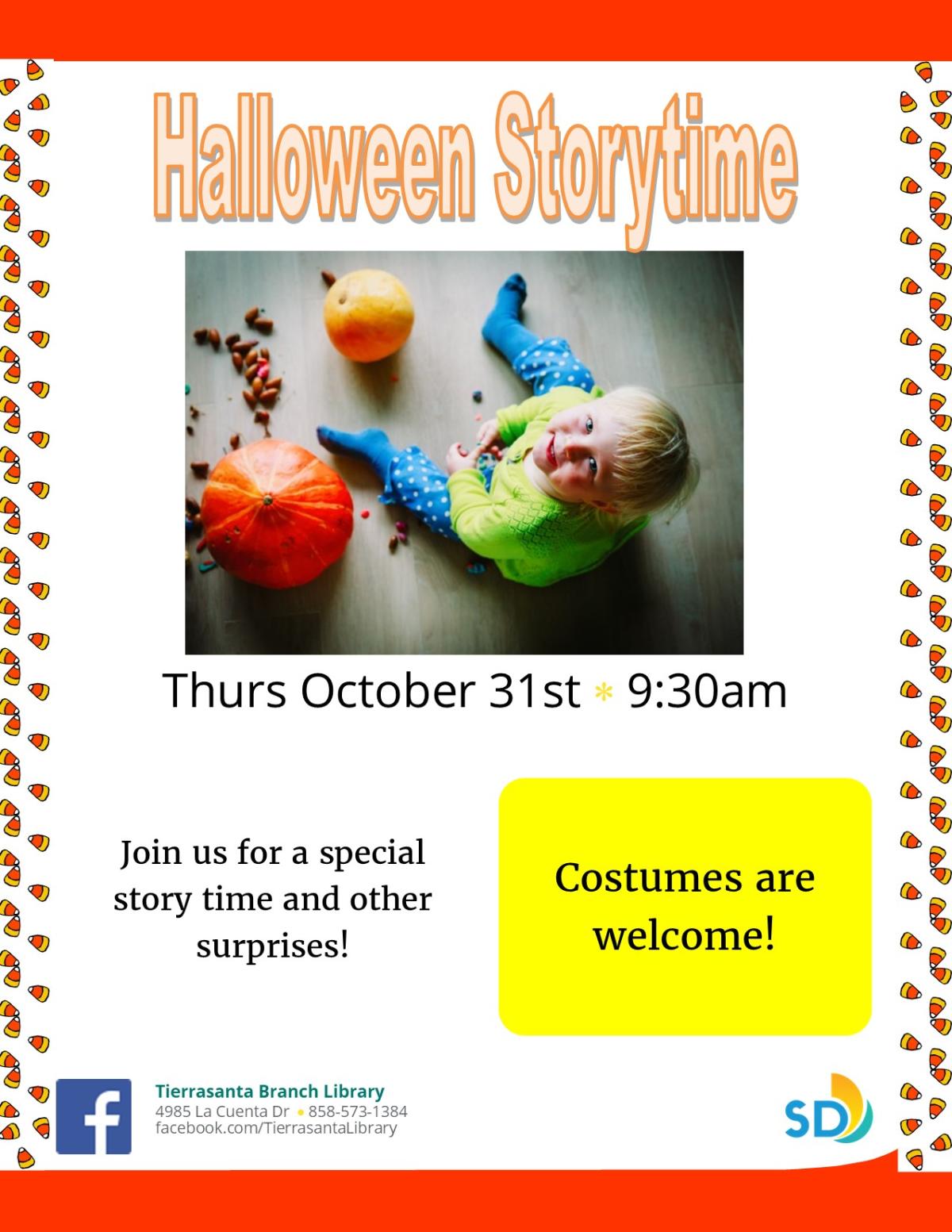 little boy surrounded by pumpkins