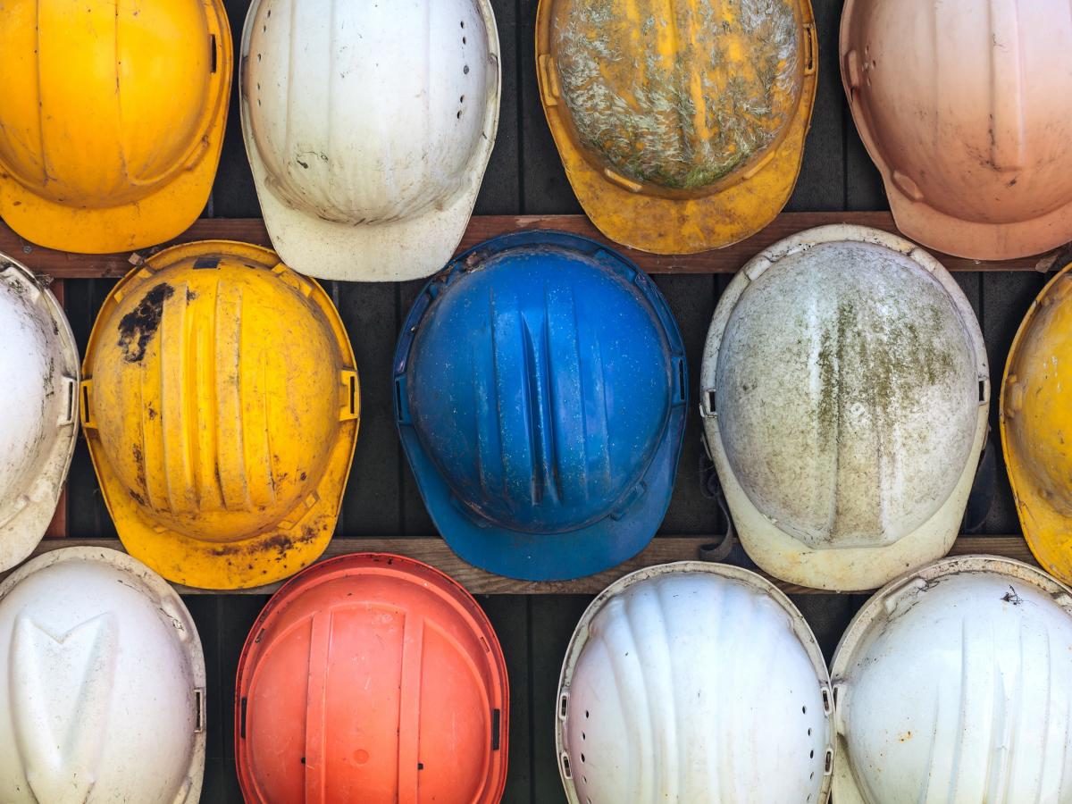 collection of hard hats in different colors