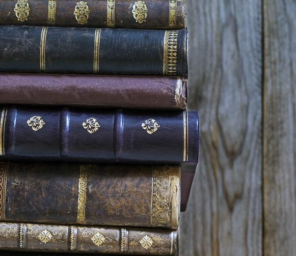 A stack of old books with character